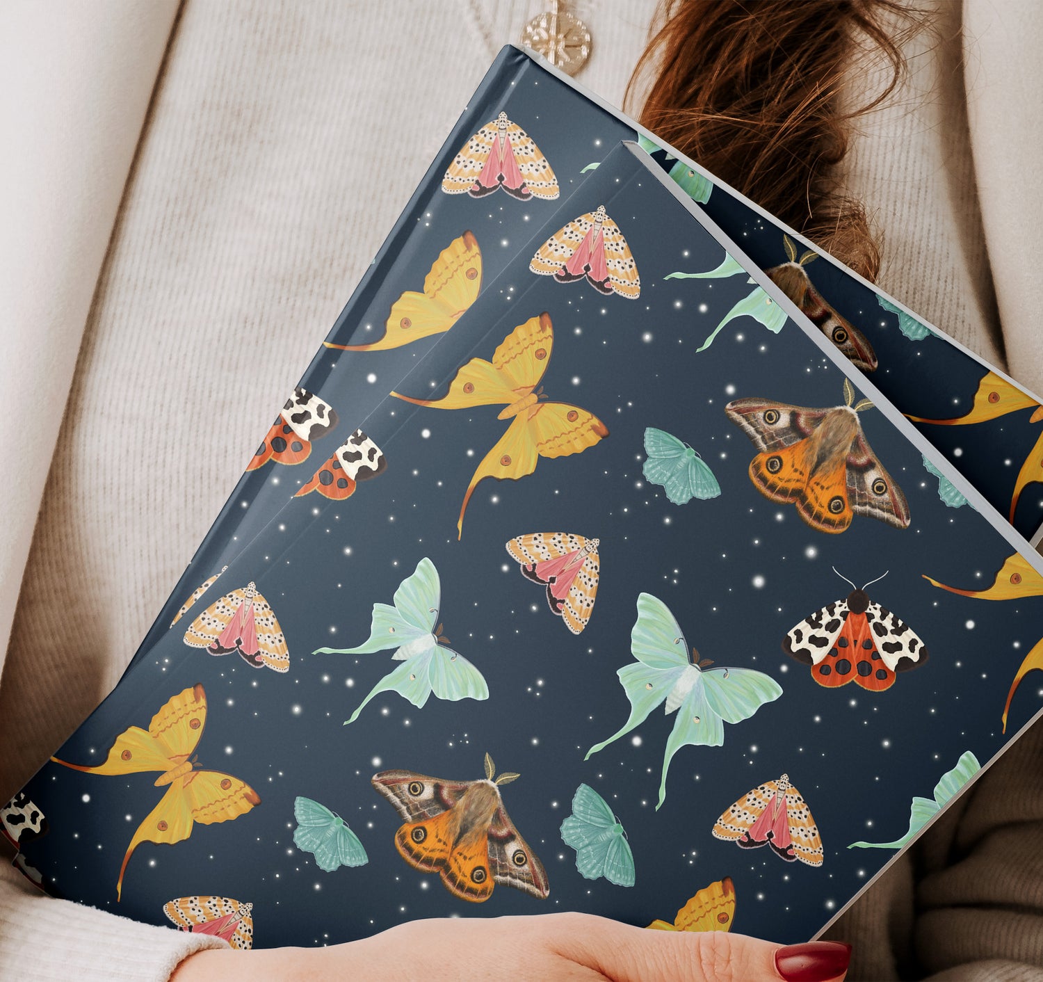 Journal with a design of moths on the front and back cover