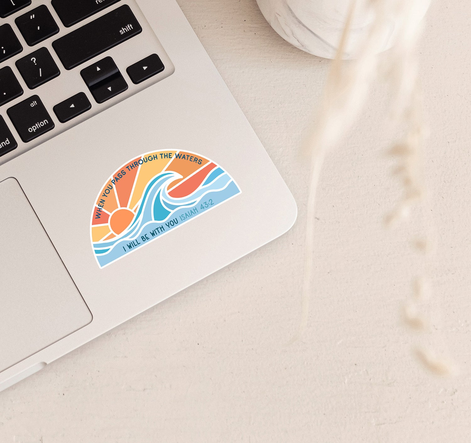 When You Pass Through The Waters, Isaiah 43:2 Bible verse laptop sticker with an ocean wave at sunset