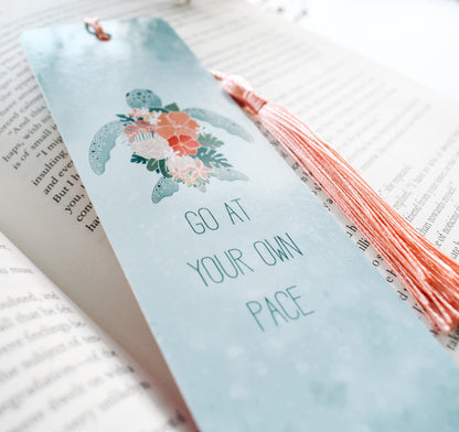 Hawaiian green sea turtle with tropical flowers bookmark and the quote &quot;go at your own pace&quot;