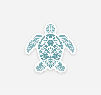 Decorative sea turtle refrigerator magnet designed with pale teal flowers