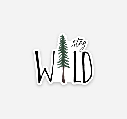 A stay wild magnet with a pine tree design