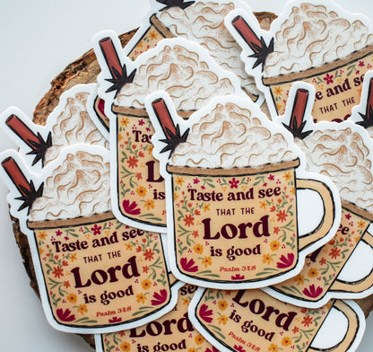 A pile of die-cut stickers shaped like coffee cups with whipped cream and cinnamon sticks, printed with the phrase &