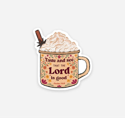 A die-cut sticker featuring a mug filled with whipped cream and a cinnamon stick, with the text &