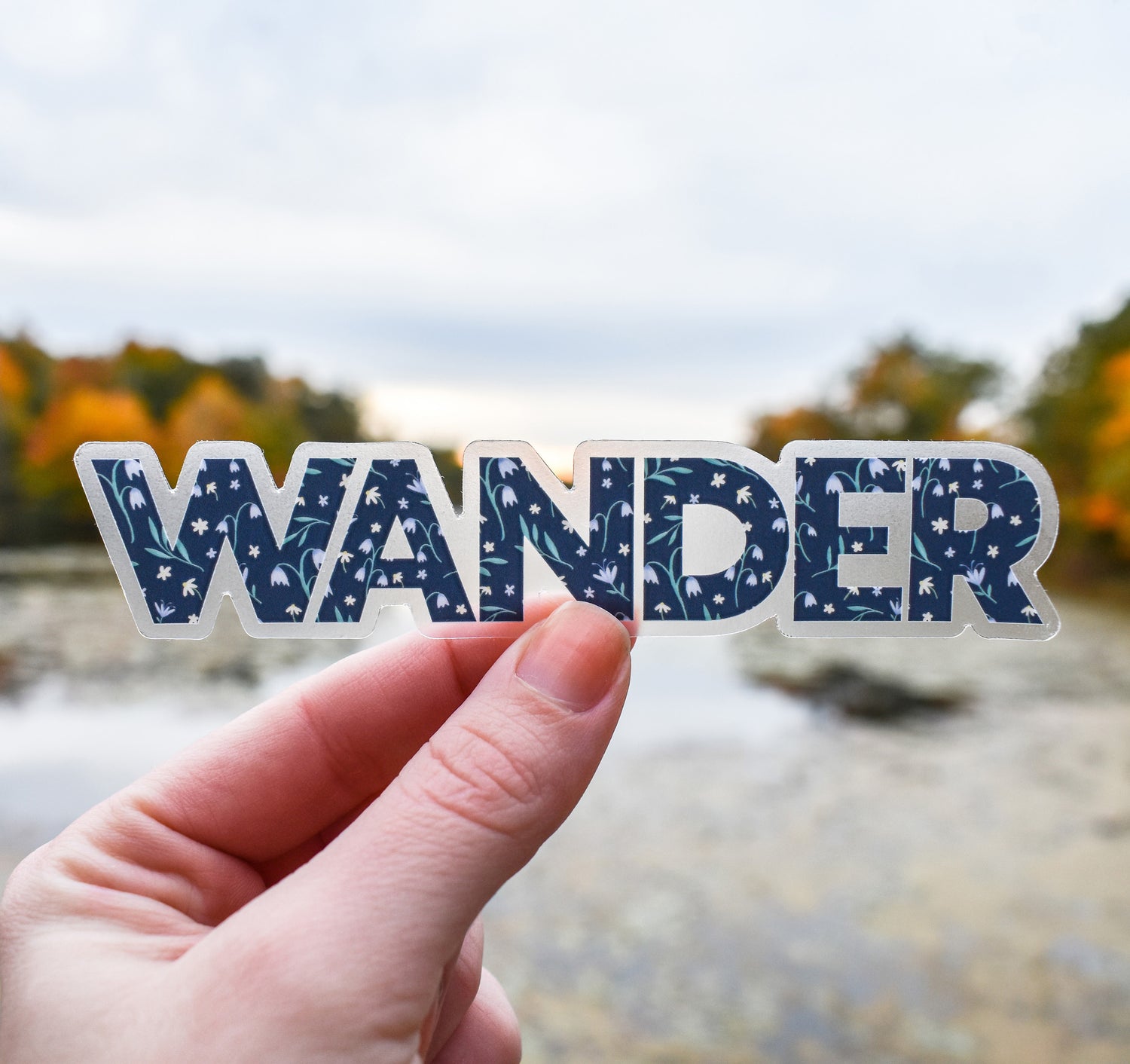 Wander clear vinyl sticker with a blue floral pattern
