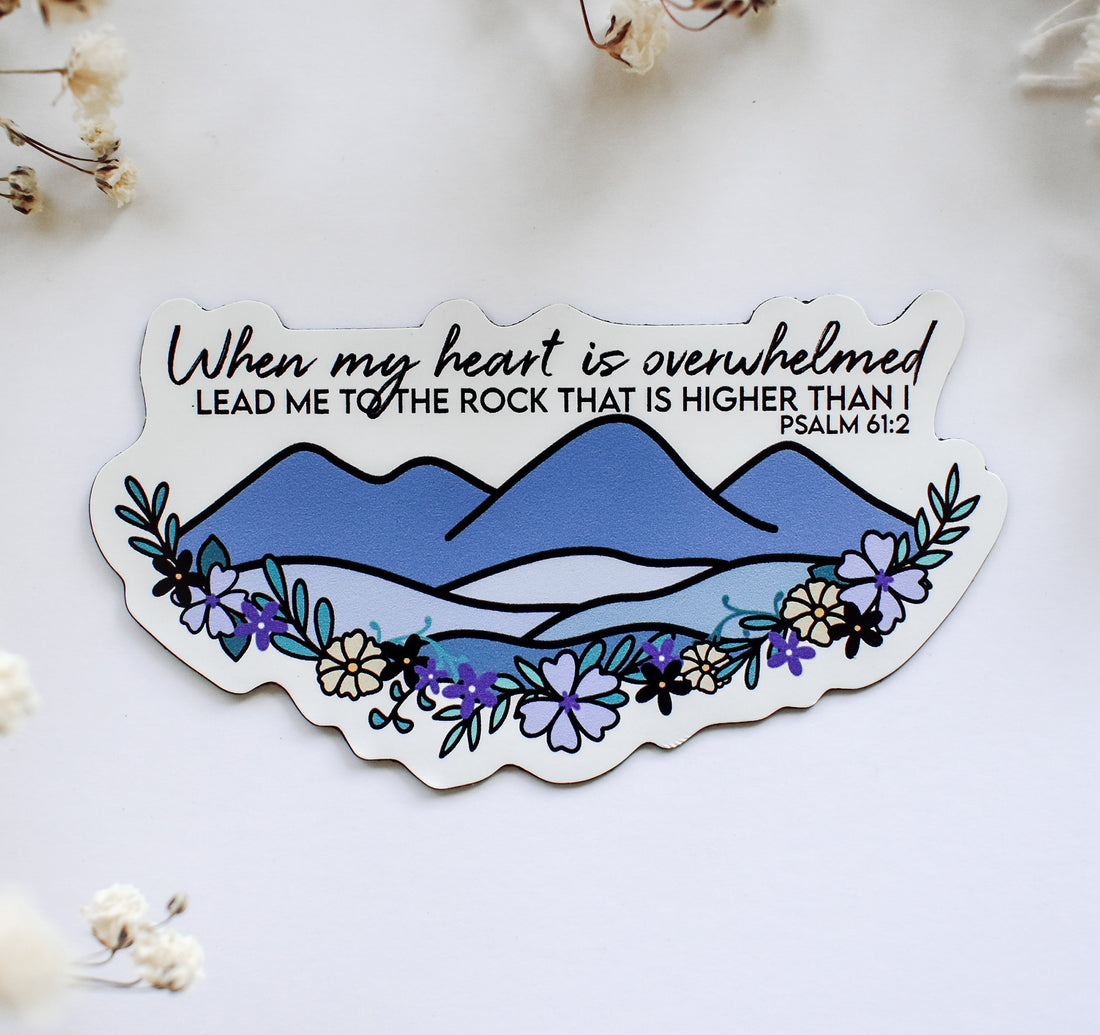 Christian faith magnet of the Psalm 61:2 Bible verse featuring a mountain and botanical florals