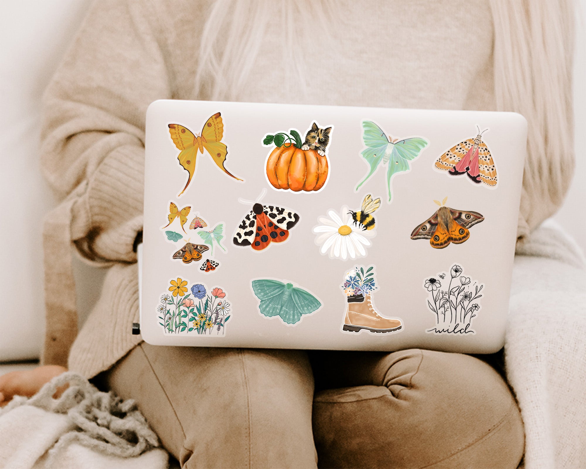 Nature and floral themed stickers decorating a laptop lid