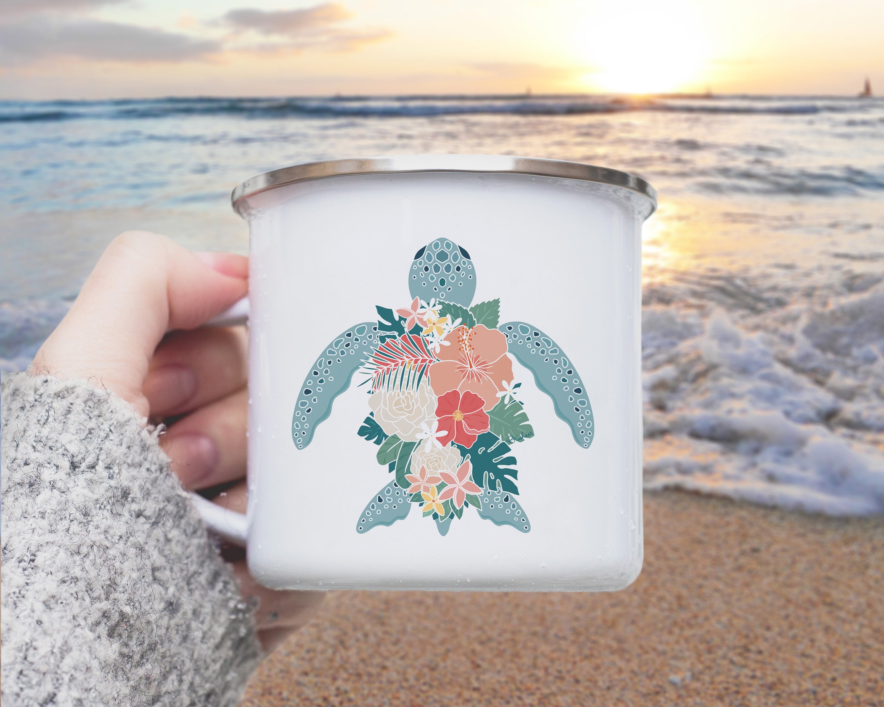 A Hawiian green sea turtle with tropical flowers shell on a metal camp mug